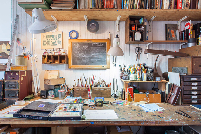 illustrator Oliver Jeffers' studio with paints and pens on table